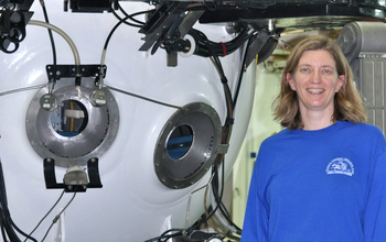 Marine scientist Amy Baco-Taylor next to a submersible in which she has conducted research.